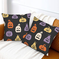 Halloween pillow covers with black colorful jack-o-lanterns, styled on a sofa