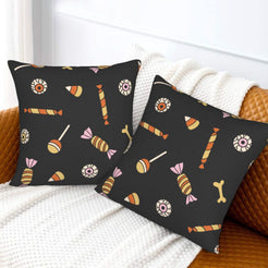 Halloween pillow covers with black candy pattern, styled on a sofa