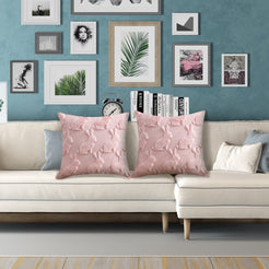 quilted polyester pillow covers with raised pink bunny silhouettes, styled on a white sectional