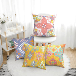 Bohemian short-pile plush pillow covers with pastel multicolor Aztec motifs, styled on a floor cushion