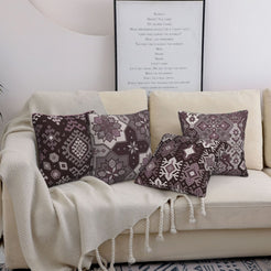 Bohemian short-pile plush pillow covers with gray and black Aztec motifs, styled on a bed