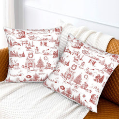 Red on white classic Christmas town toile velvet pillow covers styled on a bed