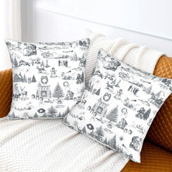 Gray on white classic Christmas town toile velvet pillow covers styled on a bed