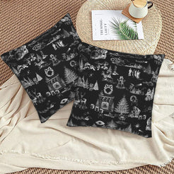 White on black classic Christmas town toile velvet pillow covers styled on a floor cushion