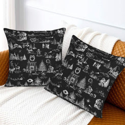 White on black classic Christmas town toile velvet pillow covers styled on a bed