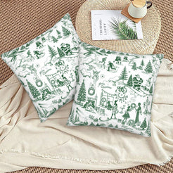 Green on white winter holiday toile velvet pillow covers styled on a floor cushion