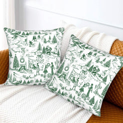 Green on white winter holiday toile velvet pillow covers styled on a bed