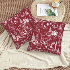 White on burgundy winter holiday toile velvet pillow covers styled on a floor cushion