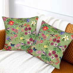 Tropical velvet pillow covers with sage butterflies and flowers, styled on a sofa