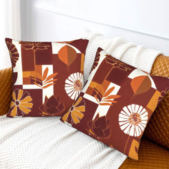 Fall velvet pillow covers with burgundy abstract blocks, leaves and flowers, styled on a white sofa