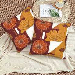Fall velvet pillow covers with burgundy and ochre geometric flowers, styled on a beige sofa