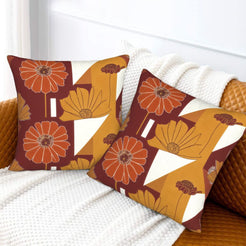 Fall velvet pillow covers with burgundy and ochre geometric flowers, styled on a white sofa