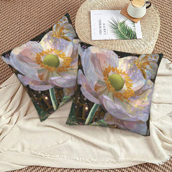 Velvet pillow covers with large pale poppies, styled on a beige sofa