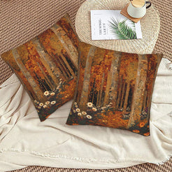 Velvet pillow covers with an orange autumn forest, styled on a beige sofa