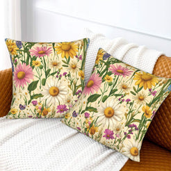 Velvet pillow covers with large pink daisies and yellow wildflowers, styled on a cream sofa