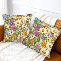 Velvet pillow covers with purple cosmos and yellow meadow flowers, styled on a cream sofa