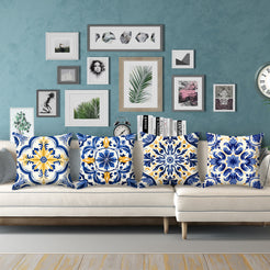 Short-pile plush pillow covers with blue, white and yellow tile medallions, styled on a cream sectional