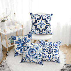 Short-pile plush pillow covers with blue and white ornate tile medallions, styled in a bright room