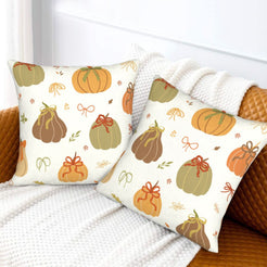 Fall velvet pillow covers with mixed pumpkins and gingham bows, styled on a white sofa