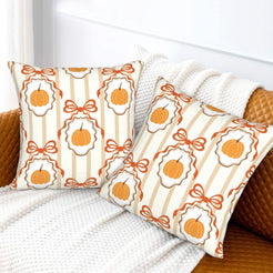Fall velvet pillow covers with framed pumpkins and bows, styled on a white sofa