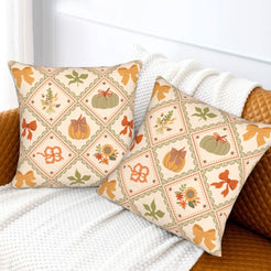 Fall velvet pillow covers with patchwork pumpkins and bows, styled on a white sofa