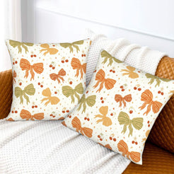 Fall velvet pillow covers with a gingham bow garland, styled on a white sofa