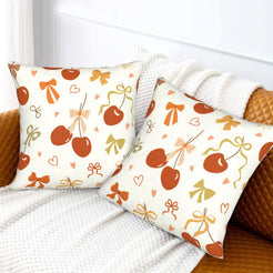 Fall velvet pillow covers with apples and gingham bows, styled on a white sofa