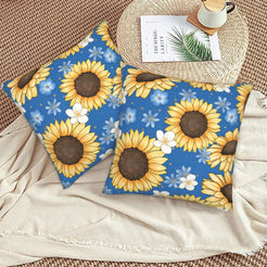 Velvet pillow covers with sunflowers and blue daisies on navy, styled on a beige sofa