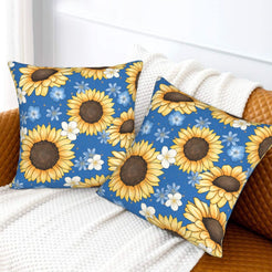 Velvet pillow covers with sunflowers and blue daisies on navy, styled on a white sofa
