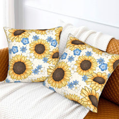Velvet pillow covers with sunflowers and small blue flowers on white, styled on a white sofa