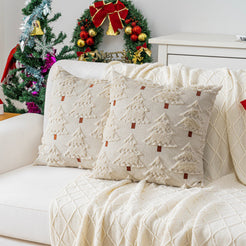 Quilted polyester pillow covers with raised cream trees on ivory, styled on a cream sofa