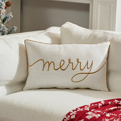Ivory embroidered Merry velvet lumbar pillow cover styled on a white sofa