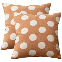 Set of two loop-pile textured polyester pillow covers with raised white polka dots on warm tan