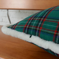 Close-up of green tartan woven cotton-polyester blend and soft white trim