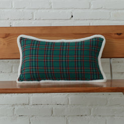 Green tartan woven cotton-polyester blend lumbar pillow cover styled on a bed