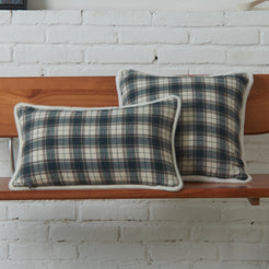 Ivory and navy tartan woven cotton-polyester blend pillow covers on a bed