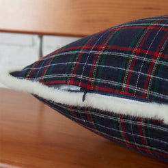 Close-up of navy and red tartan woven cotton-polyester blend with white trim