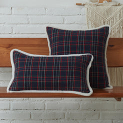 Navy and red tartan woven cotton-polyester blend pillow covers on a bed