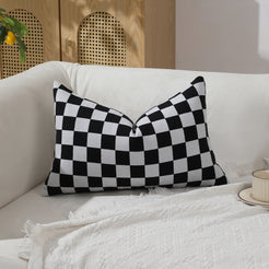 Black and white checkerboard chenille lumbar pillow cover on a sofa