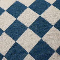 Close-up of blue and ivory checkerboard chenille texture