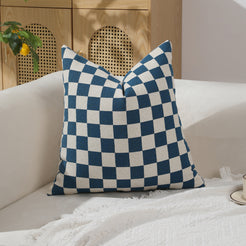 Blue and ivory checkerboard chenille square pillow cover on a sofa