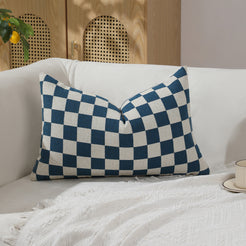 Blue and ivory checkerboard chenille lumbar pillow cover on a sofa