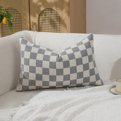 Gray and ivory checkerboard chenille lumbar pillow cover on a sofa