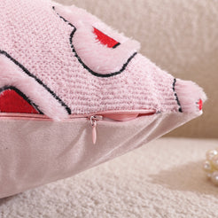 Close-up of hidden zipper and embroidery on embroidered woven polyester pillow cover with outlined red hearts on pink