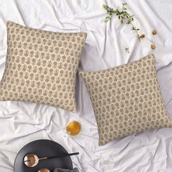 Set of two water-resistant pillow covers with beige small floral motifs, styled on a bed