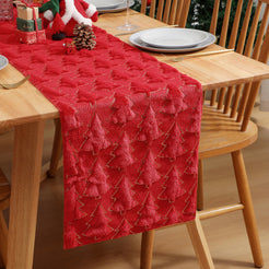 Red furry Christmas tree table runner on a dining table