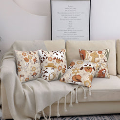 short-pile plush polyester pillow covers with cowboy ghosts, skeletons and cactus prints, styled on a cream sofa