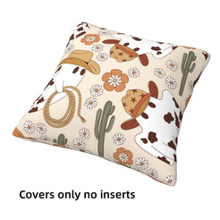 short-pile plush polyester pillow cover with cowboy ghost, hats, flowers and cactus on cream, shown at an angle on white