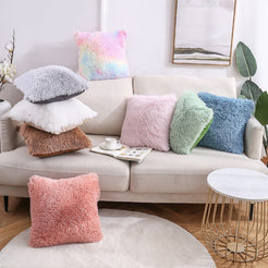 Faux-fur plush polyester pillow covers with assorted solid colors and long-pile texture, styled around a cream sofa