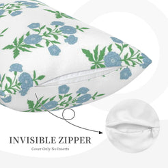 Hidden zipper detail on long lumbar pillow cover with blue-green floral branches on white